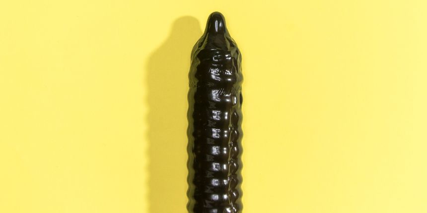 Black dildo with yellow background - Lovesexshop.ie sex shop