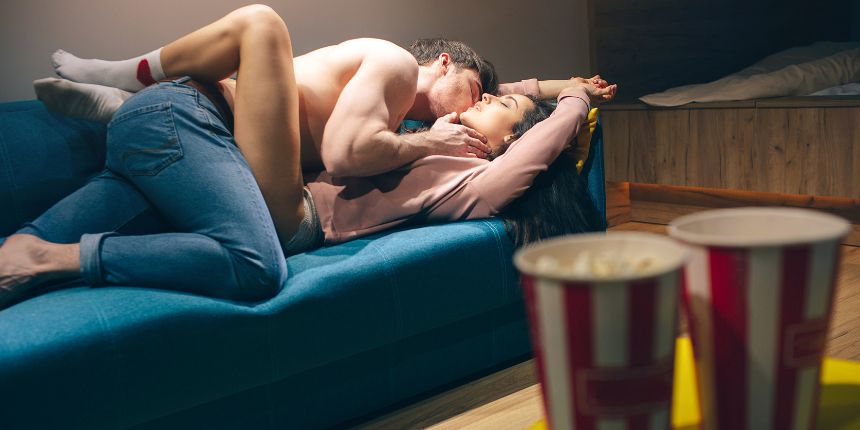 Couple kissing during an erotic movie night at home | Lovesexshop.ie sex shop